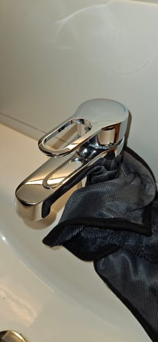 A mixer tap polished to a shine with the Wove microfibre cloth