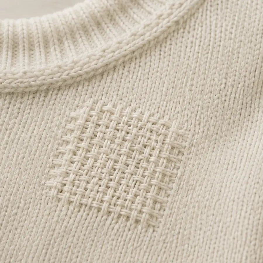 The same jumper with the hole woven closed using Wove