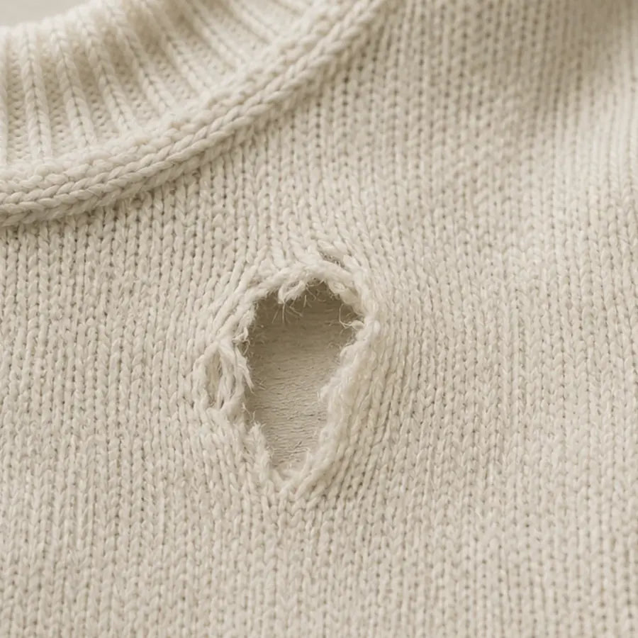 Knitted jumper with a hole near the neckline